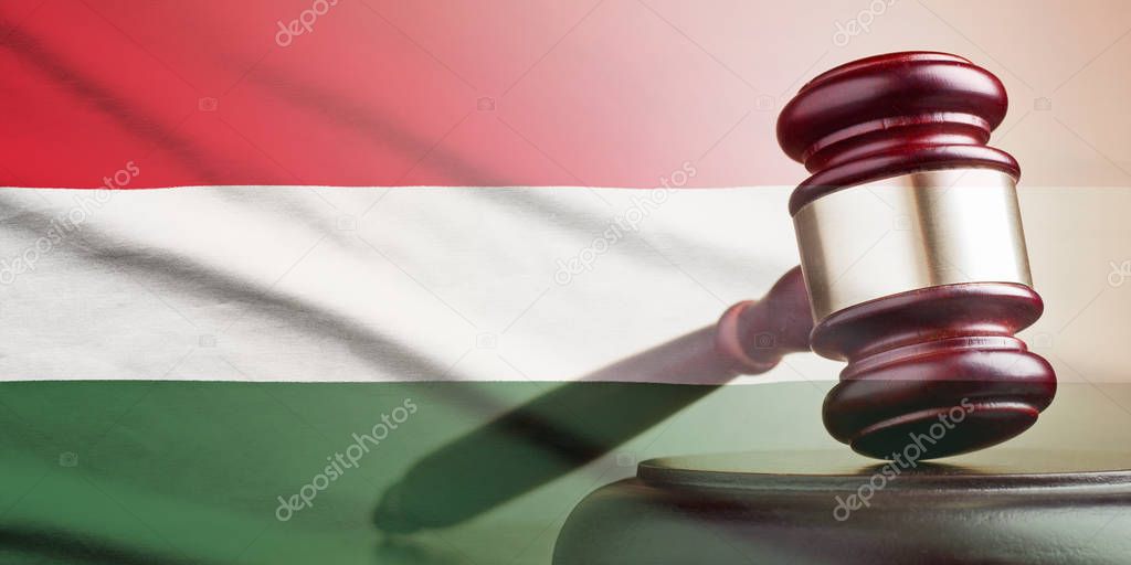 Legal gavel over a flag of the Hungary