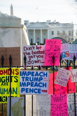 WASHINGTON JANUARY 20, 2018: Demonstrators rally in support of womens rights and urge America to vote in Democrats in the 2018 midterm elections at the Womens March on January 20, 2018 in Washington, DC   clipart