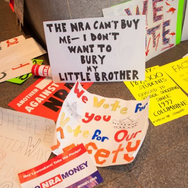 Discarded signs from the March for Our Lives, a protest by students for gun control, on March 24, 2018 in Washington DC   clipart