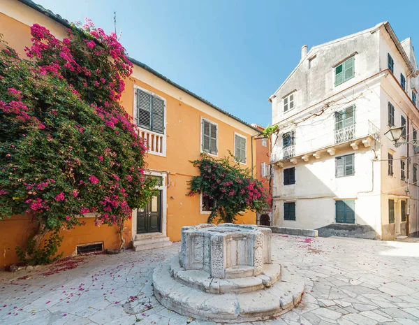 Courtyard with venetian well in Kerkyra, Corfu, Greece