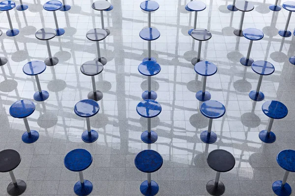 Rows of tall round tables — Stock Photo, Image