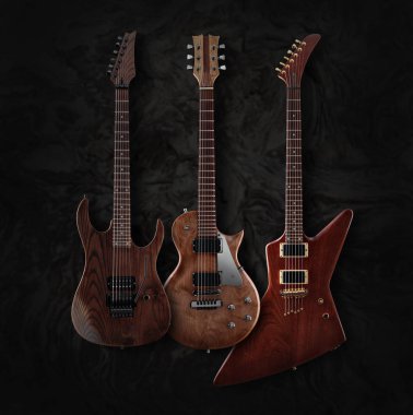 Set of custom electric guitars with natural finish clipart