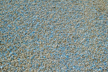 Küçük mavi taş kaplı yüzey parçası arka plan doku çakıl.