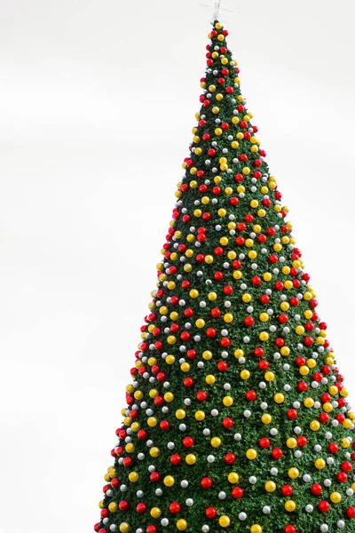 Christmas tree with decorates balls and large beautiful star at — Stock Photo, Image