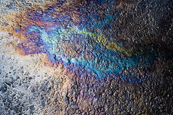 Oil stain on Asphalt road after rain — Stock Photo, Image