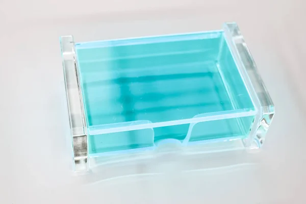 transparent blue plastic box on white background