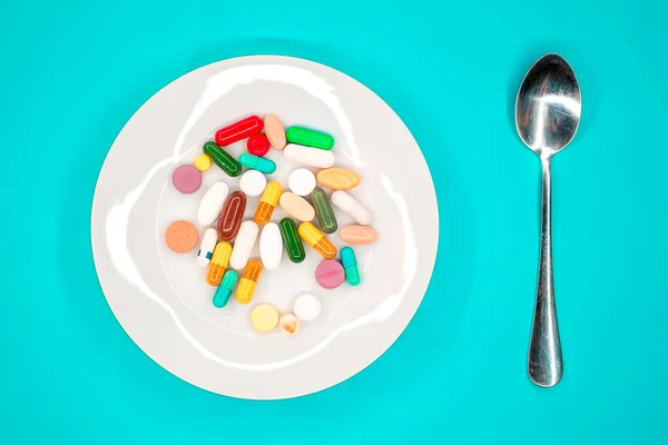 White Plate Pills Spoon Turquoise Background — Stock Photo, Image