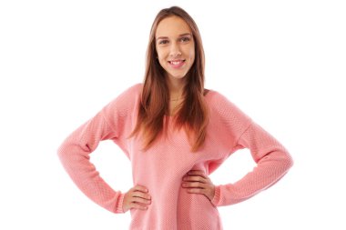 Neşeli bir genç kadın ayakta el ile kendine güvenen pozisyonda