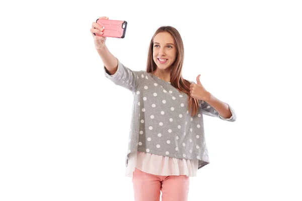 Caucasian girl in cheerful mood is making selfie photo via smart — Stock Photo, Image