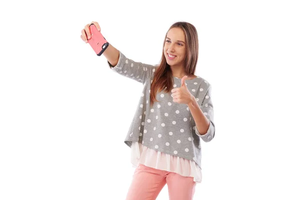 Menina feliz está tomando selfie e mostrando ok gesto isolado sobre — Fotografia de Stock