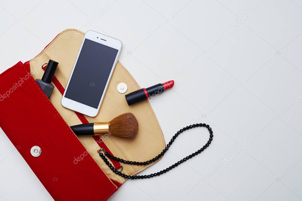 Makeup purse against flat layout 