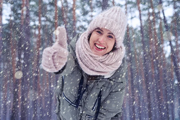 Joyful female smiling and showing thumb up at the camera — Stock Photo, Image