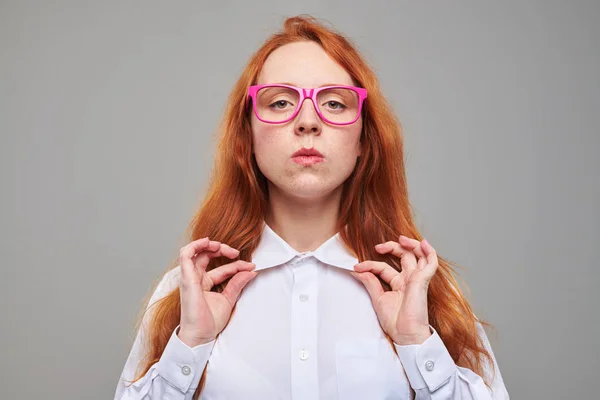 Confident readhead teen adjusting blouse collar — Stock Photo, Image