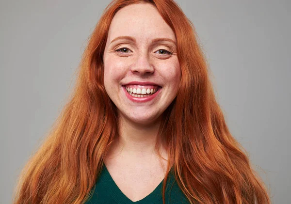 Broadly smiling redhead woman with freckles — Stock Photo, Image
