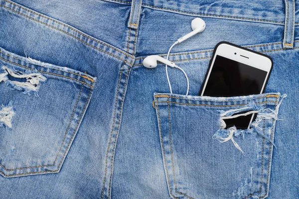 Vista aérea de bolsillo con teléfono y auriculares — Foto de Stock