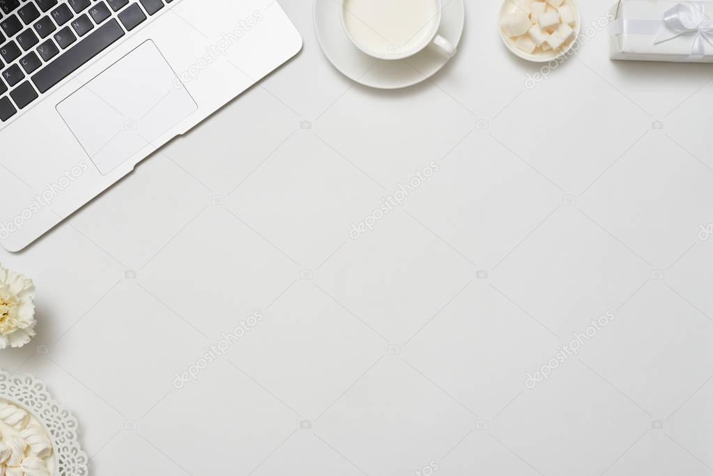 Desktop with laptop, flat lay picture with copy space