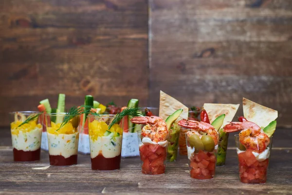 Colorful composition of different tasty appetizers presented in — Stock Photo, Image