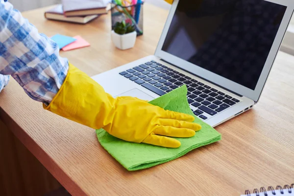 Female in yellow rubber gloves cleaning with mop laptop — Stock Photo, Image
