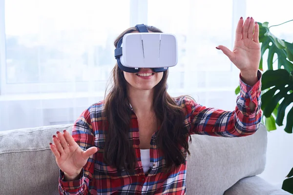 Pretty female playing in VR glasses — Stock Photo, Image