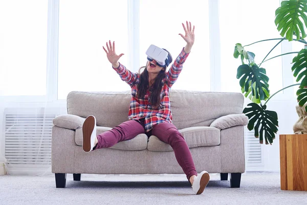 Cheerful girl playing in VR glasses — Stock Photo, Image