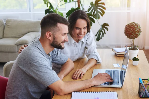 Gorgeous lady and sir surfing in laptop while sitting at table — Stock Photo, Image