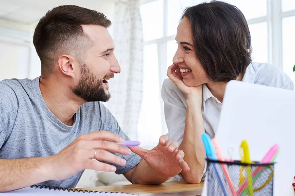 Lovely couple looking at each other while discussing something — Stock Photo, Image