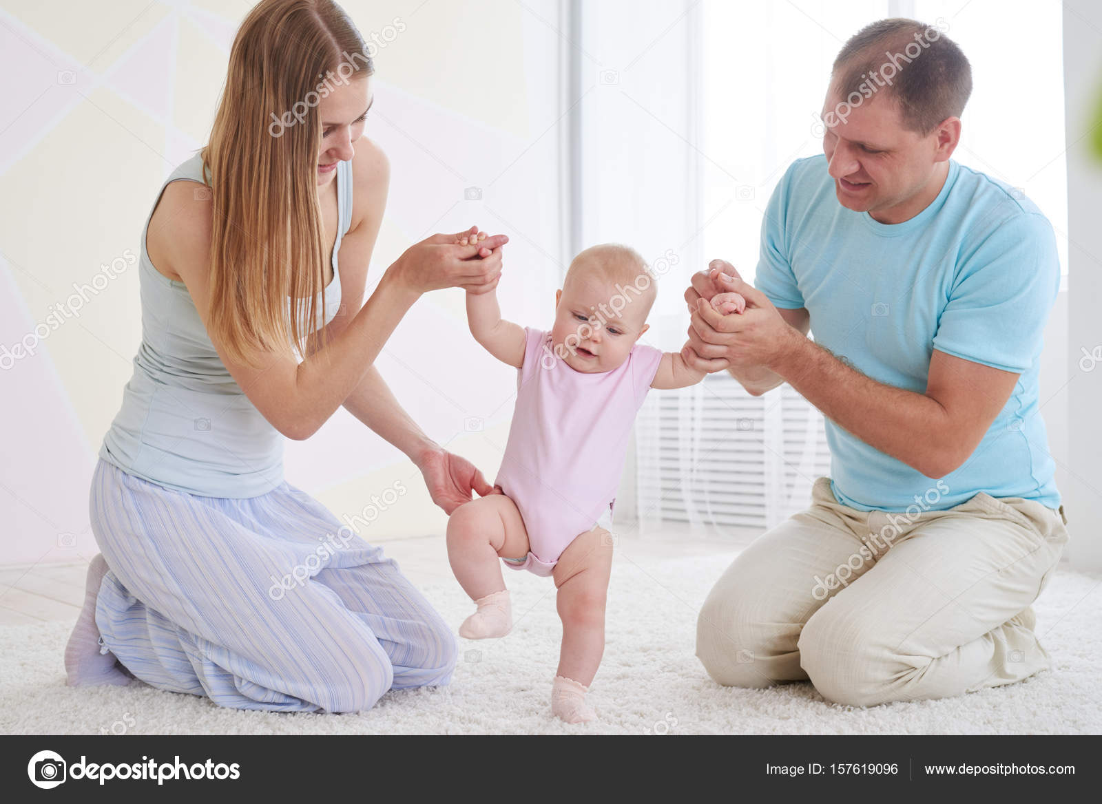 Parents teaching baby to walk — Stock Photo © konstantynov