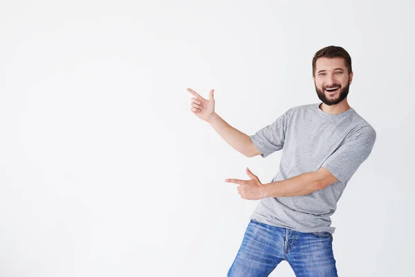 Chico señalando sobre fondo blanco — Foto de Stock