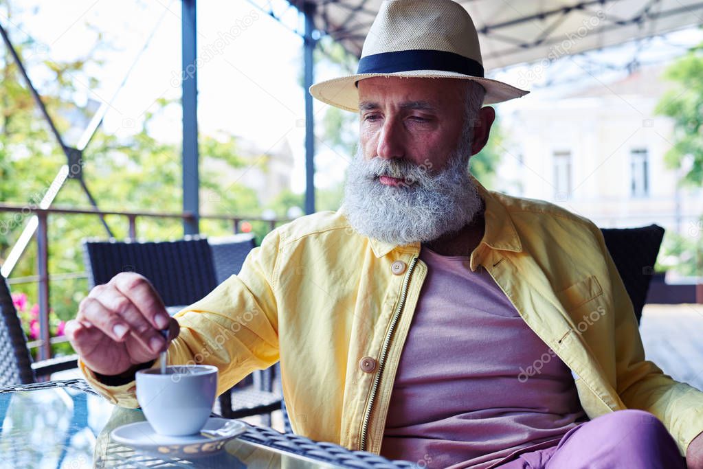 Elderly man in cafe