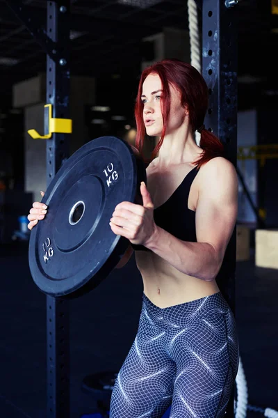 Determined athlete lifting barbells looking focused — Stock Photo, Image