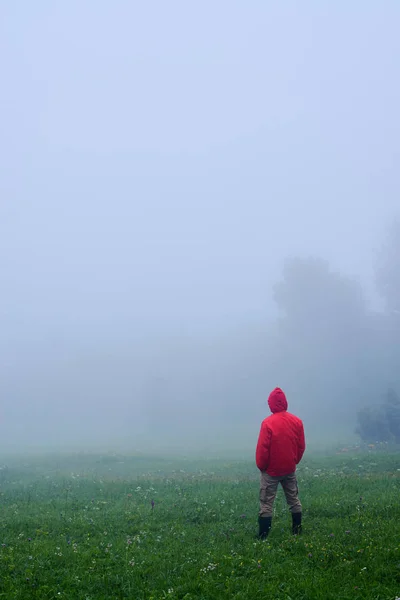 Man standing in waterproof jacket