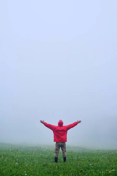 Male in waterproof jacket in Carpathian mountains