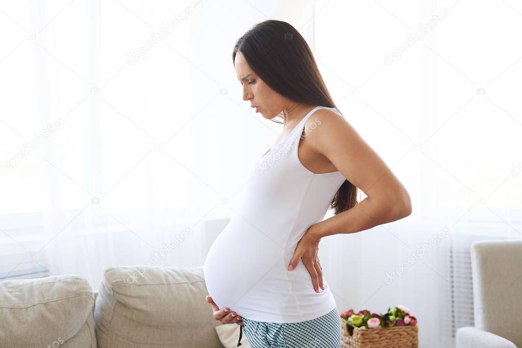 Pregnant woman suffering lower back pain