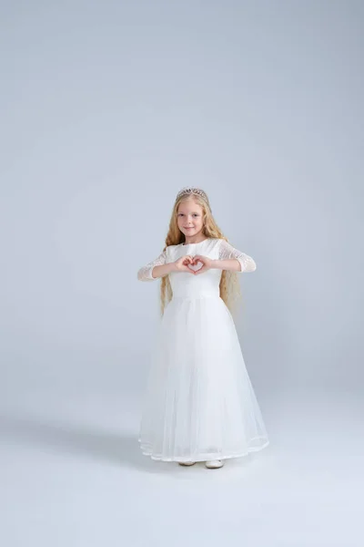 Lovely princess making heart shape with her hands — Stock Photo, Image