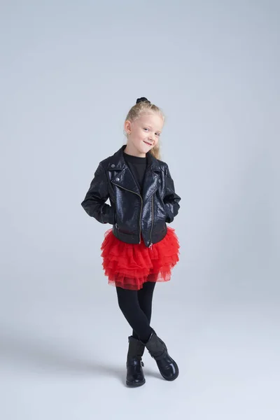 Trendy small girl in rock style clothing posing — Stock Photo, Image