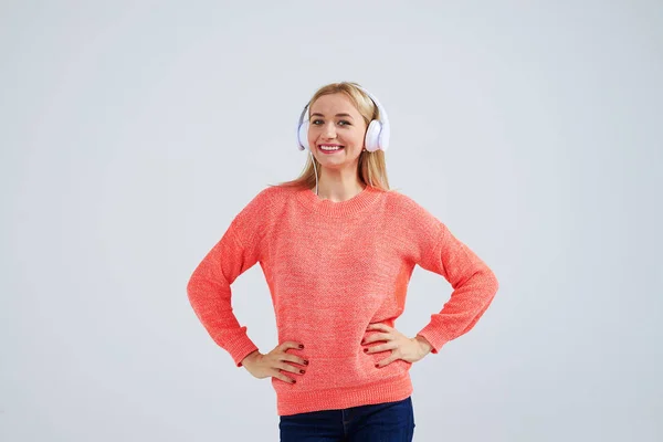 Smiley blond in headphones over white — Stock Photo, Image