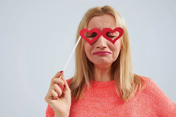 Funny blond in paper heart shaped glasses crying — Stock Photo, Image