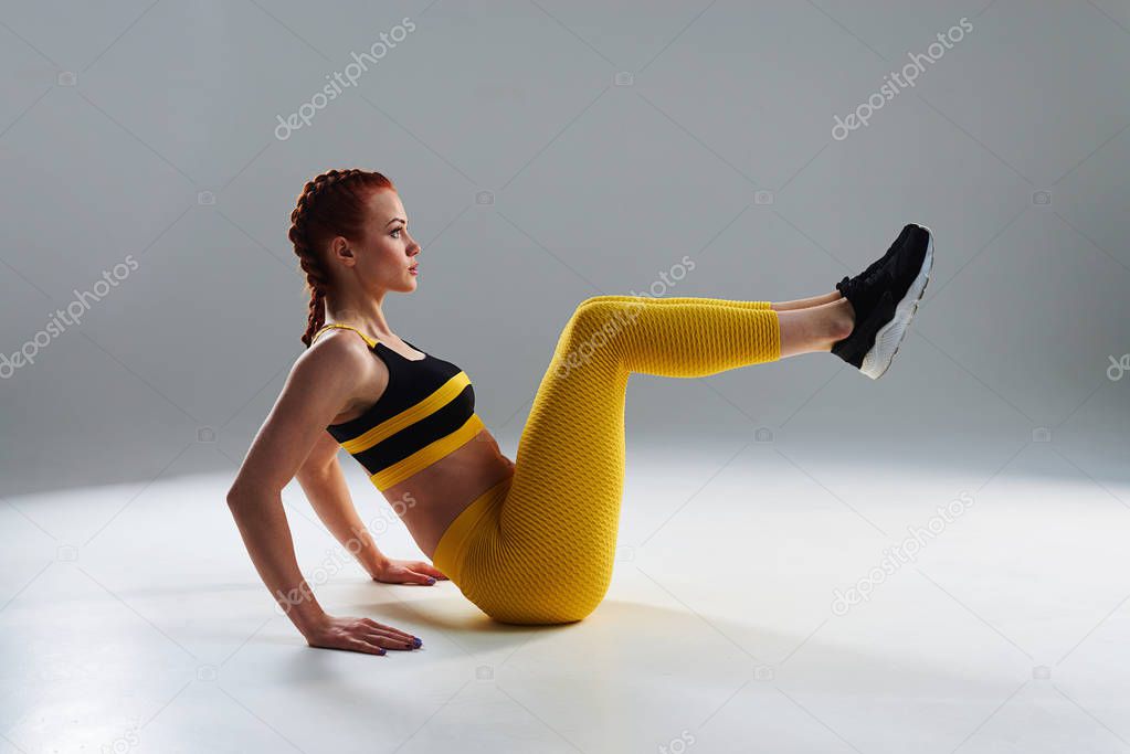sportswoman training core muscles