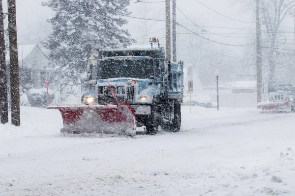 Snow plow plowing the streets