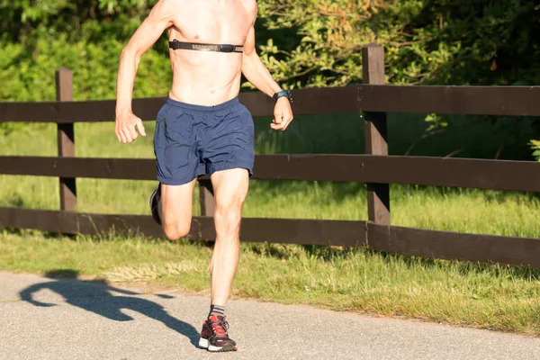 Man running shirtless on a sunny afternoon ⬇ Stock Photo, Image by ...