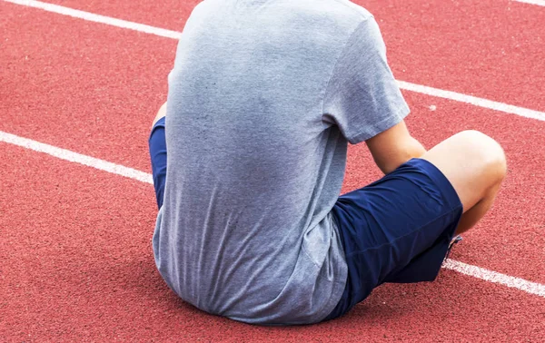 Stretching on a red track