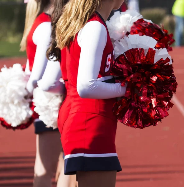 High school cheerleaders during a football game