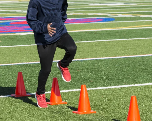 Running dspee drill over orange cones — Stock Photo, Image