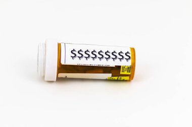 Dollar signs on a prescription pill bottle with a white backgrou clipart