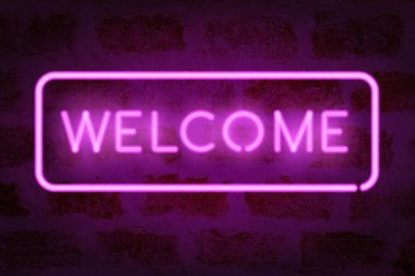 Neon hoş geldiniz. Vektör parlayan işaret tuğla duvar