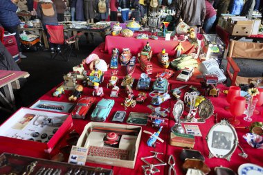 Istanbul, Turkey - March 1, 2020 : Antique tin vehicle toys with many other objects at The Bomonti Antique Bazaar at Istanbul.