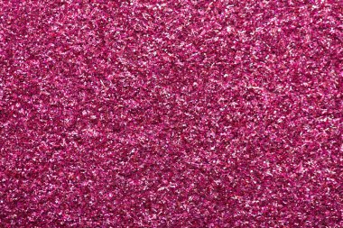 Folyo pembe renkli düz döşeme fotografı kapat. Pembe moda parlak desenli arka plan.