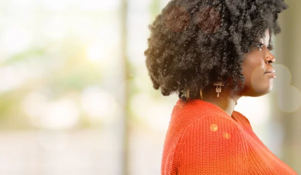 Beautiful african woman side view portrait, outdoor