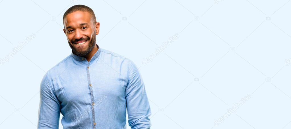 African american man with beard confident and happy with a big natural smile looking side isolated over blue background