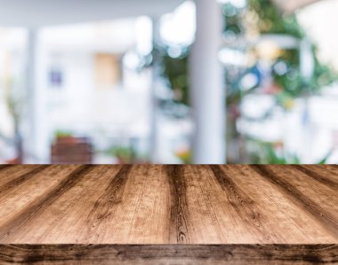 Wooden empty table board in front of blurred background. Can be used for display or montage any product. Mock up for display your product. clipart